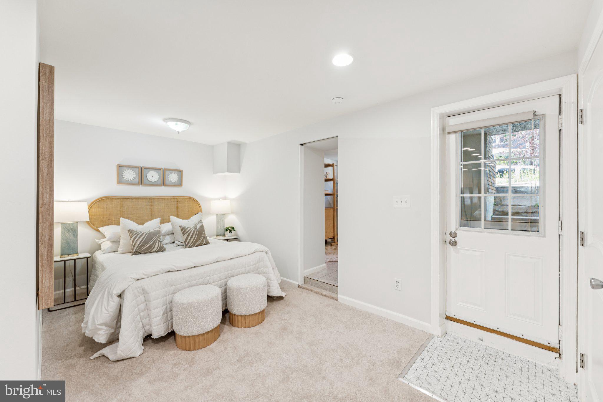 1412 Decatur Street Northwest Washington, DC 20011 - Photo 30 of 36 a bedroom with a bed and a window