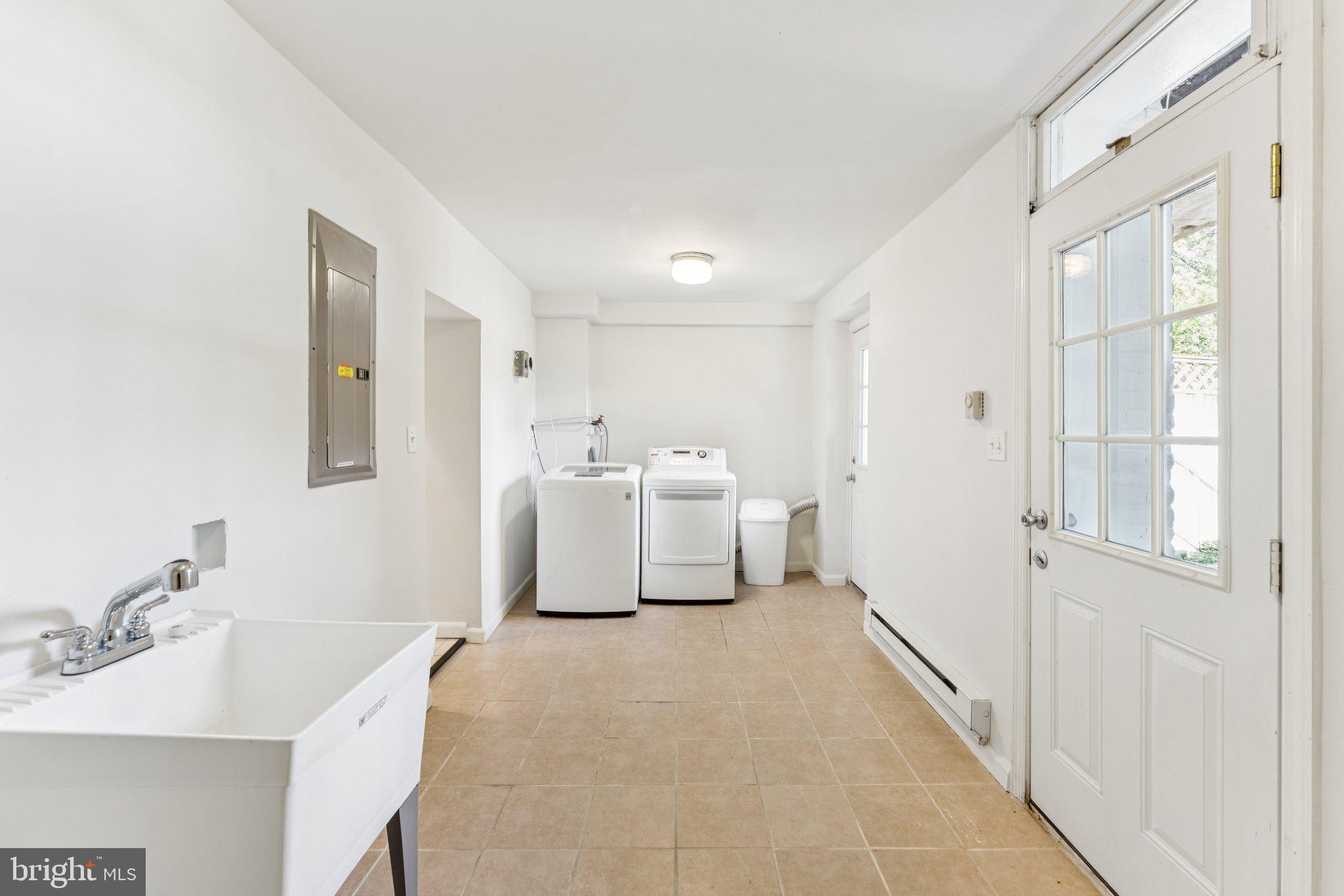 1412 Decatur Street Northwest Washington, DC 20011 - Photo 33 of 36 a bathroom with a sink a mirror and a shower