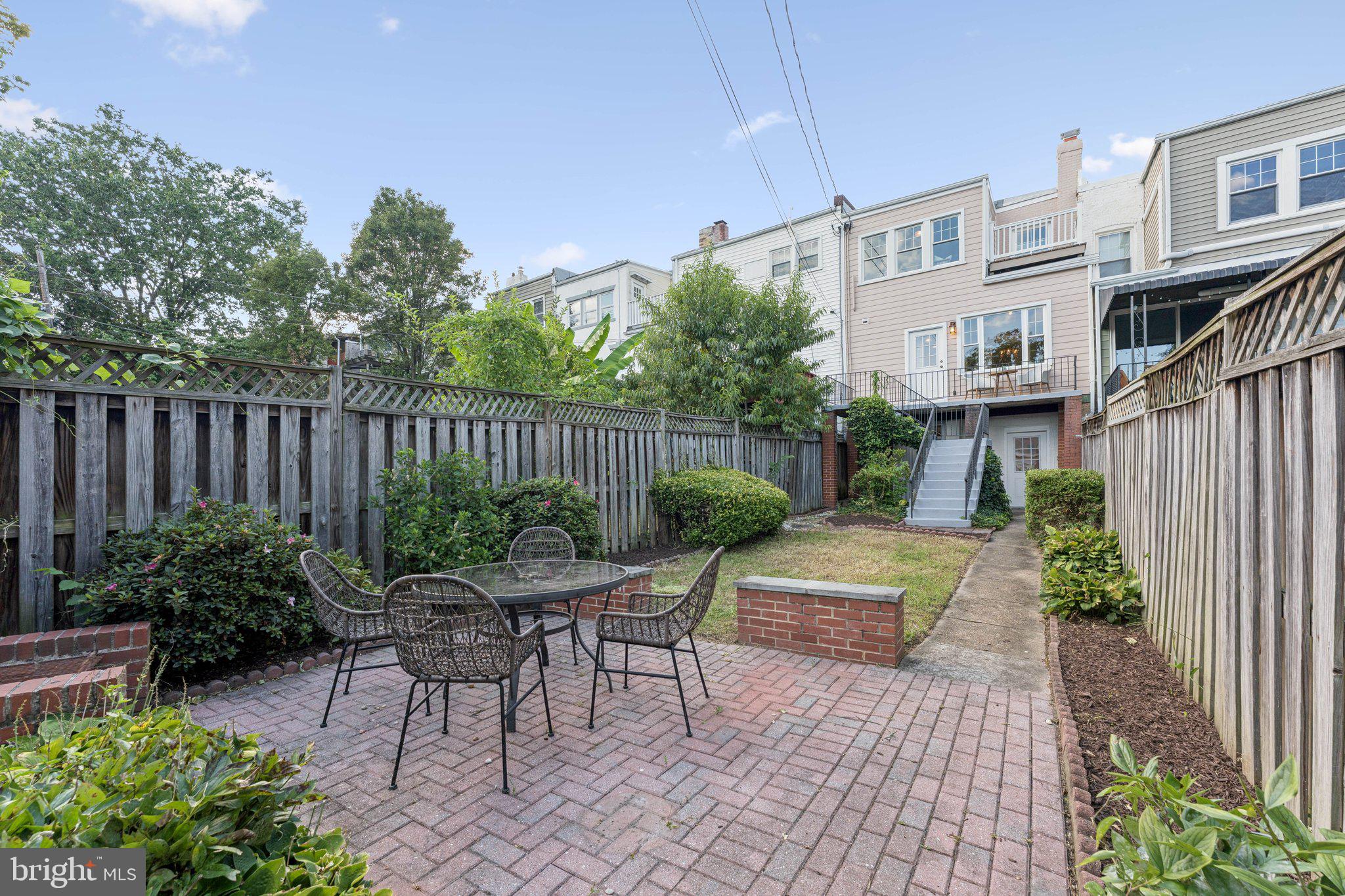 1412 Decatur Street Northwest Washington, DC 20011 - Photo 34 of 36 a view of a chairs and tables in the back yard of the house