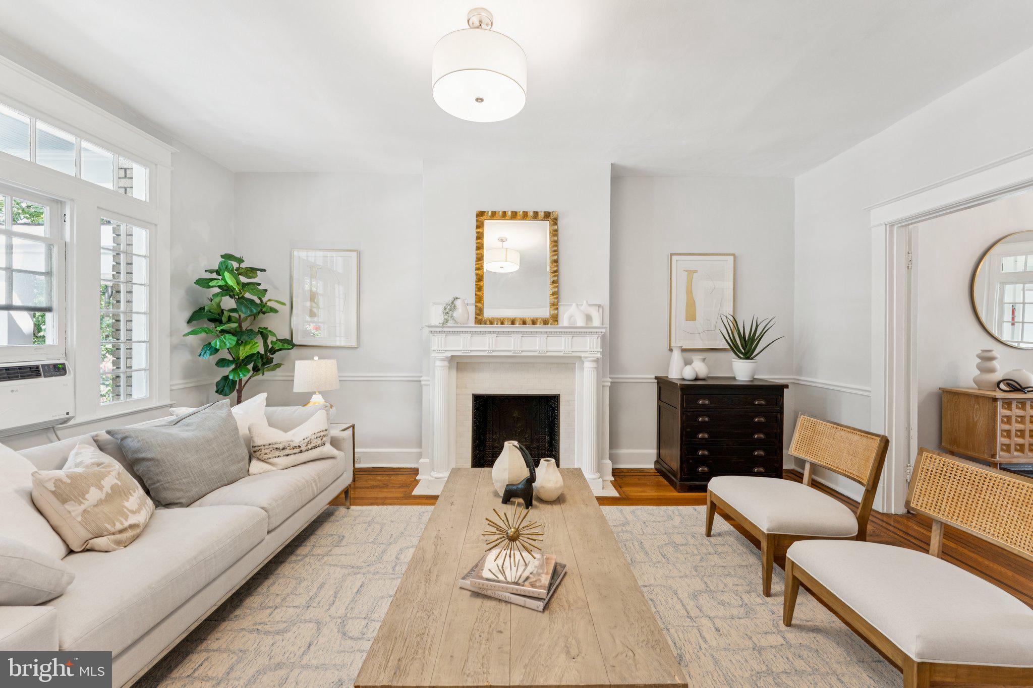 1412 Decatur Street Northwest Washington, DC 20011 - Photo 4 of 36 a living room with furniture a fireplace and a large mirror