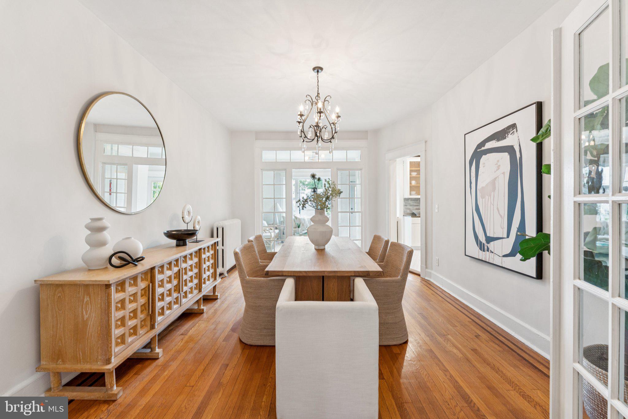 1412 Decatur Street Northwest Washington, DC 20011 - Photo 7 of 36 a living room with furniture a mirror and a chandelier