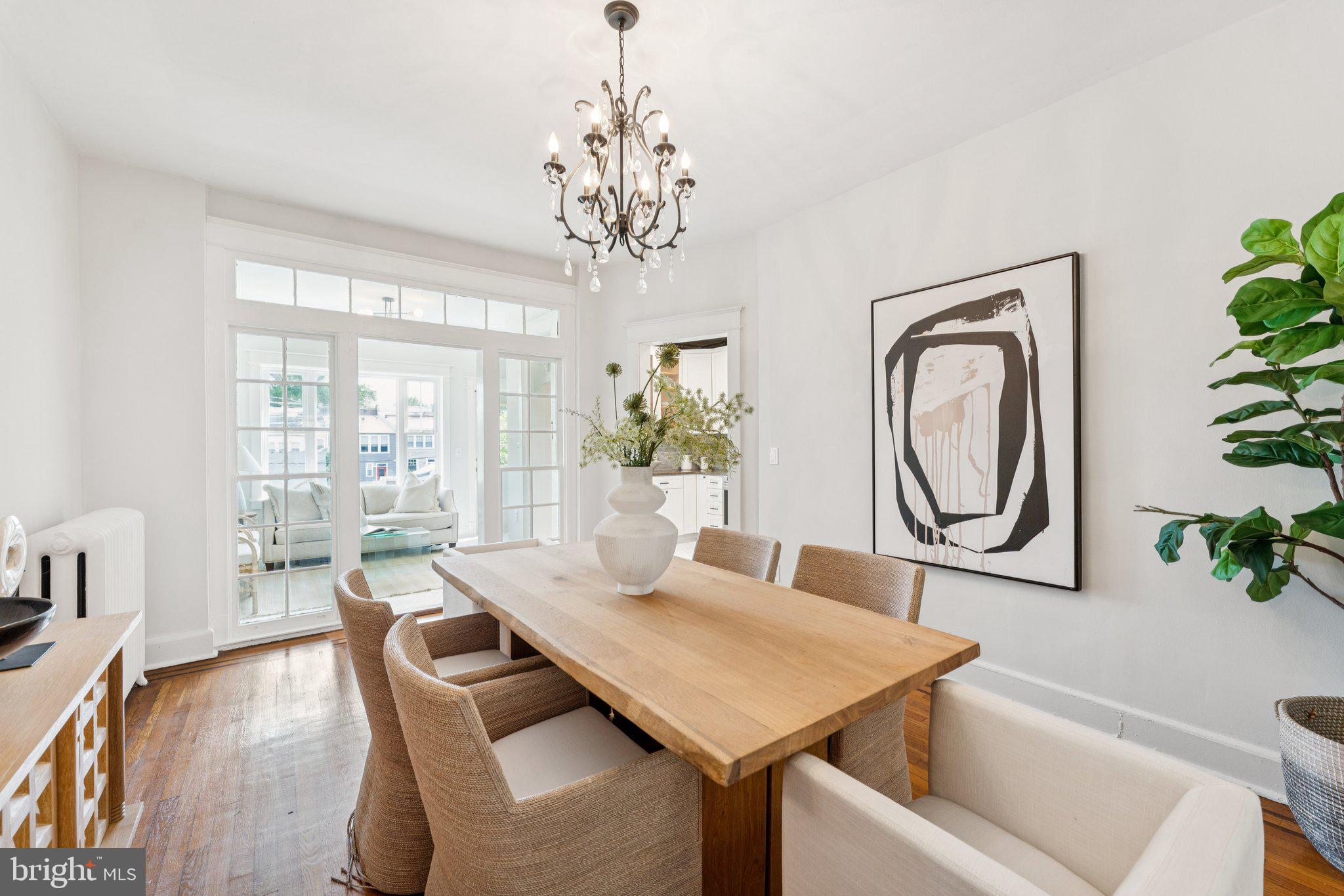 1412 Decatur Street Northwest Washington, DC 20011 - Photo 9 of 36 a view of a dining room with furniture window and wooden floor