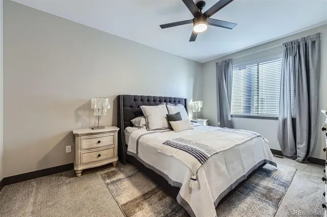 a bedroom with bed and window