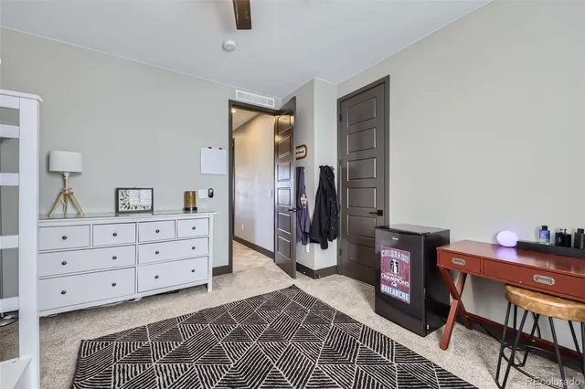 a room with furniture and a dresser