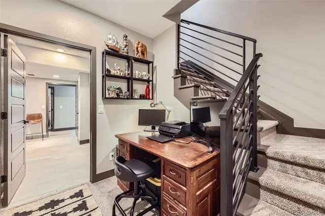 a view of a workspace with furniture