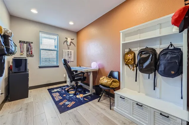 a workspace with furniture and window