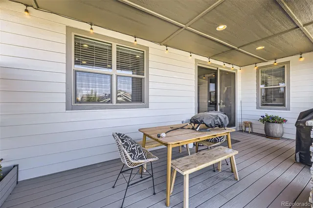 a table and chairs in front of the house