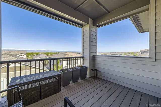 a view of a balcony with chairs