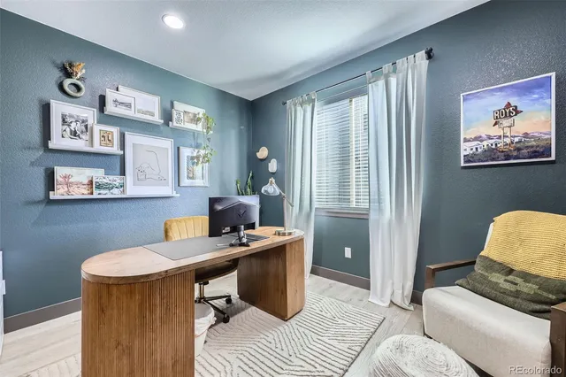 a work room with furniture and a window