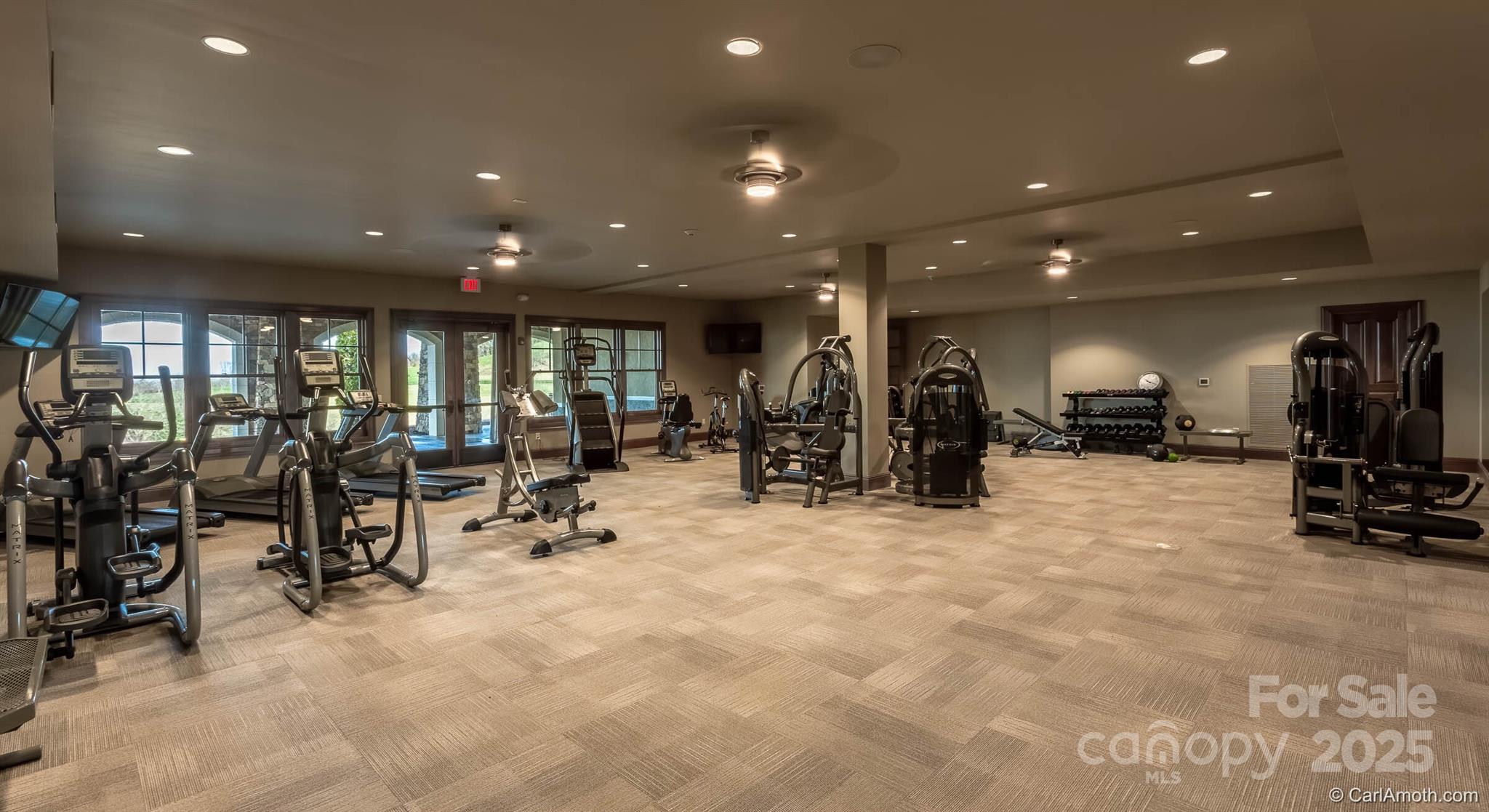 475 Dancing Bear Drive Hendersonville, NC 28792 - Photo 24 of 29 a view of a room with gym equipment and lots of equipment