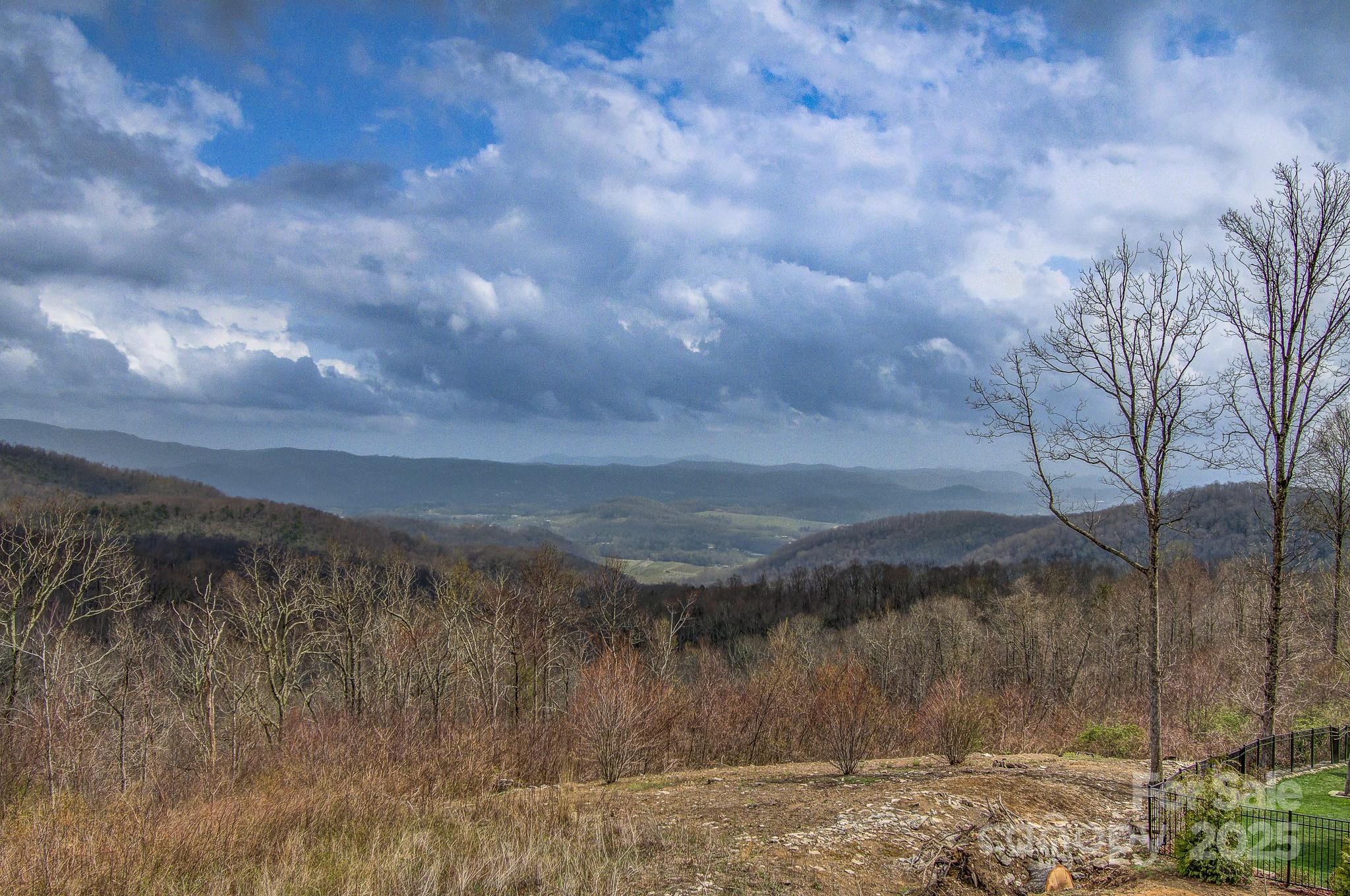 475 Dancing Bear Drive Hendersonville, NC 28792 - Photo 3 of 29 a view of a lake and mountain in the back