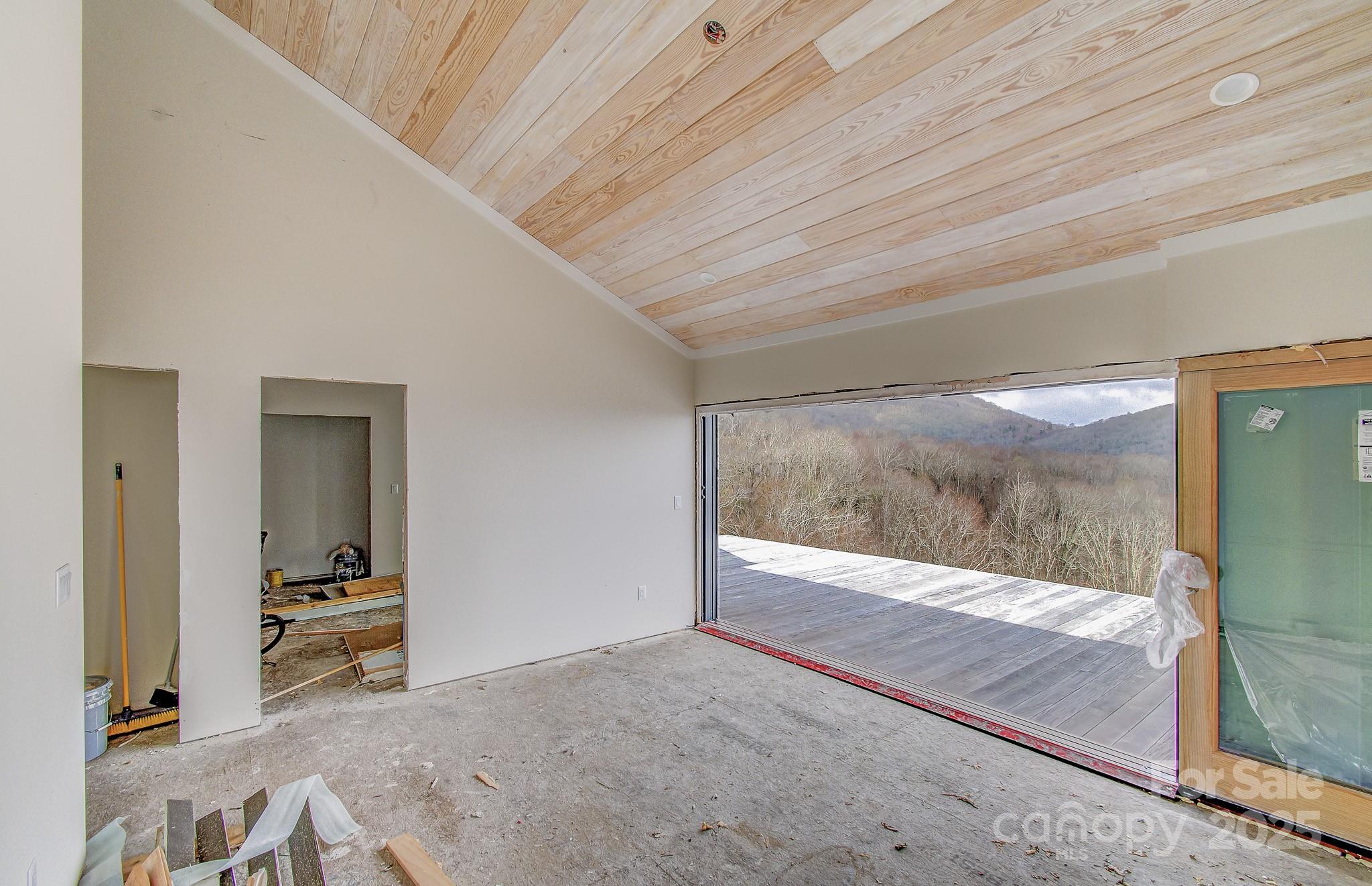 475 Dancing Bear Drive Hendersonville, NC 28792 - Photo 7 of 29 a living room with a balcony