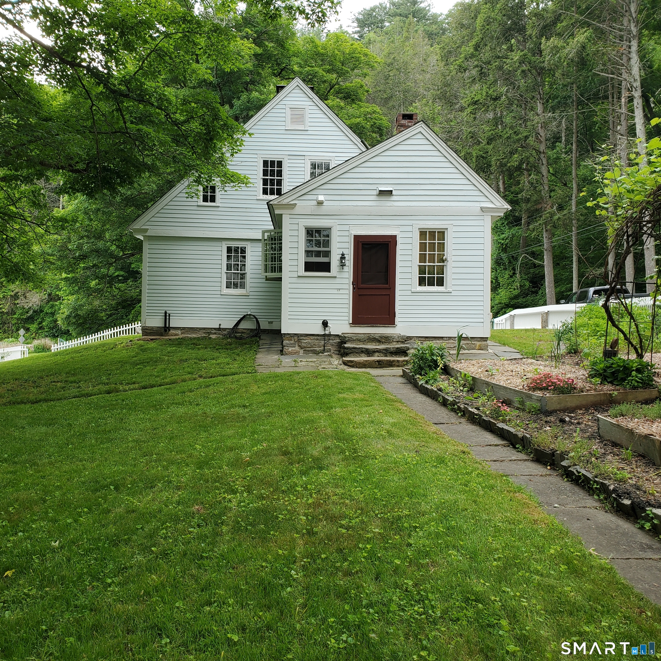 24 Ayer Road Franklin, CT 06254 - Photo 5 of 15 Walkway leading past the vegetable & herb garden into the kitchen.