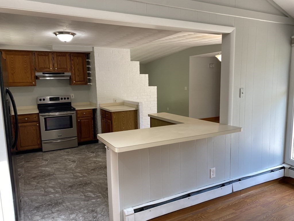28 Savoy Road Framingham, MA 01701 - Photo 11 of 42 a kitchen with stainless steel appliances a sink dishwasher stove refrigerator and microwave