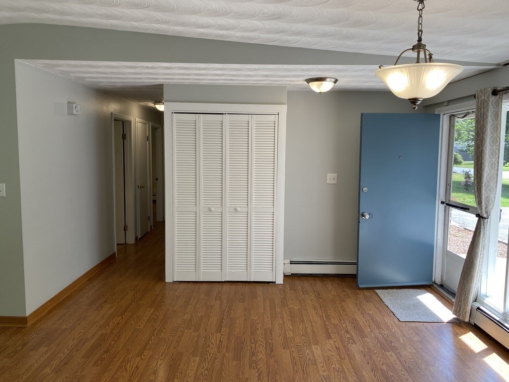 28 Savoy Road Framingham, MA 01701 - Photo 13 of 42 a view of a livingroom with wooden floor and staircase