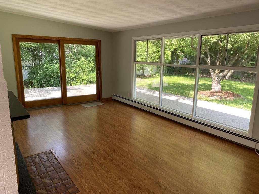 28 Savoy Road Framingham, MA 01701 - Photo 14 of 42 a view of empty room with wooden floor and fan