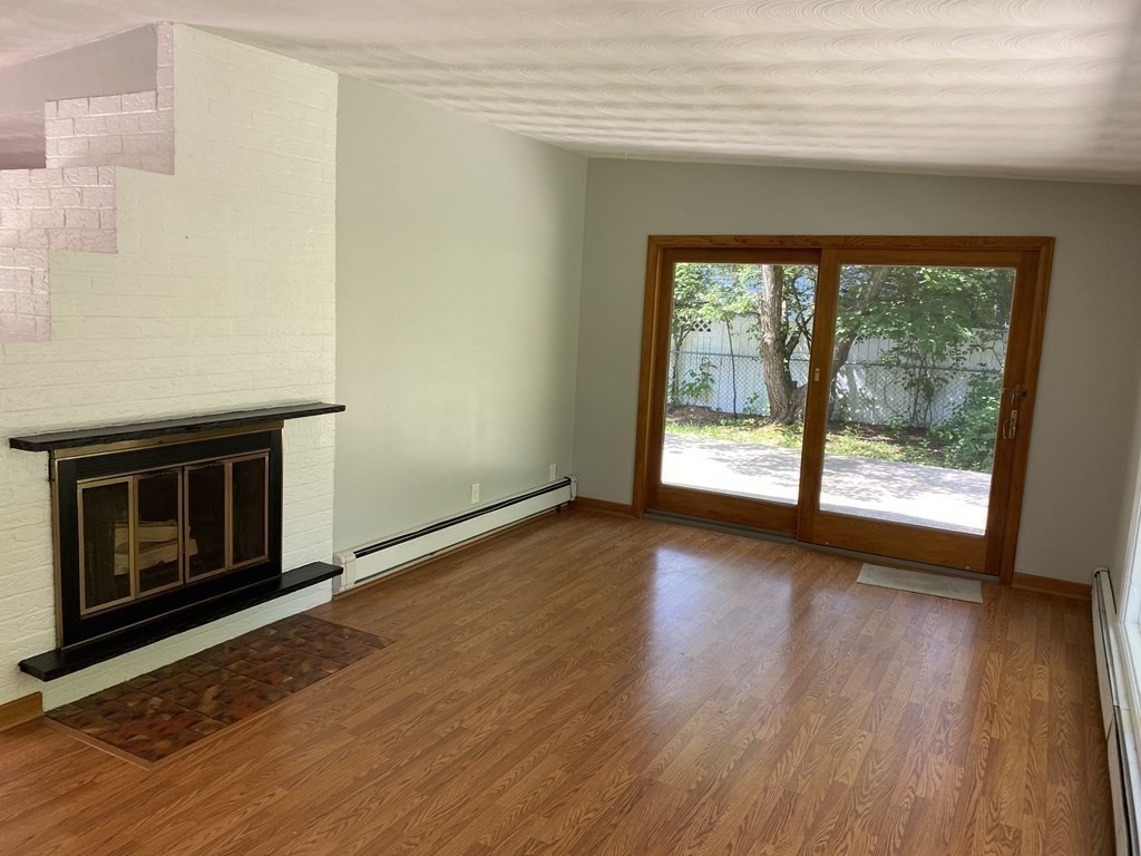 28 Savoy Road Framingham, MA 01701 - Photo 15 of 42 a view of an empty room with wooden floor and a window