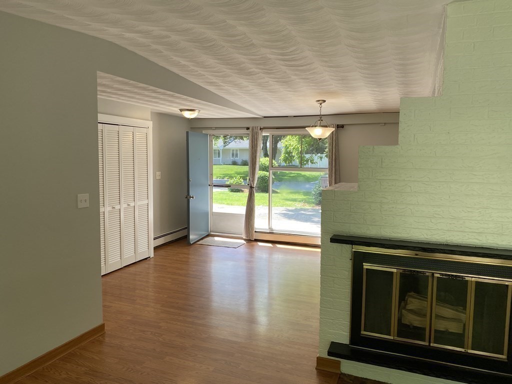 28 Savoy Road Framingham, MA 01701 - Photo 17 of 42 a view of an empty room with wooden floor and a window