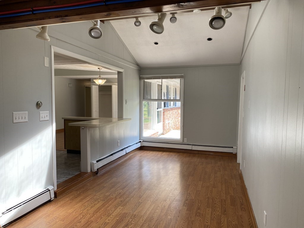 28 Savoy Road Framingham, MA 01701 - Photo 20 of 42 a view of a refrigerator in kitchen and wooden floor