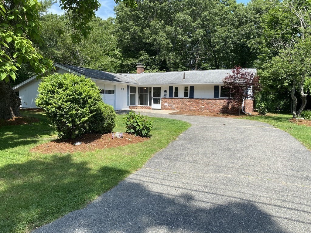 28 Savoy Road Framingham, MA 01701 - Photo 2 of 42 a front view of a house with a yard and a garage