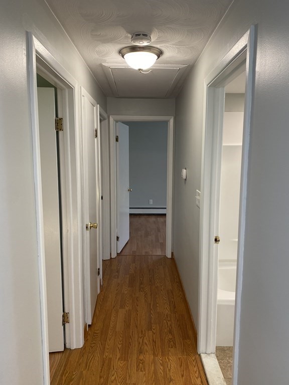 28 Savoy Road Framingham, MA 01701 - Photo 21 of 42 a view of a hallway with wooden floor
