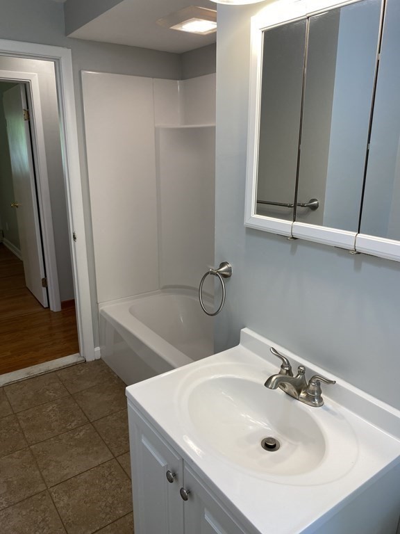 28 Savoy Road Framingham, MA 01701 - Photo 22 of 42 a bathroom with a sink a toilet and a tub