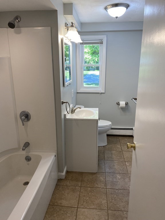 28 Savoy Road Framingham, MA 01701 - Photo 23 of 42 a bathroom with a sink a toilet and bathtub