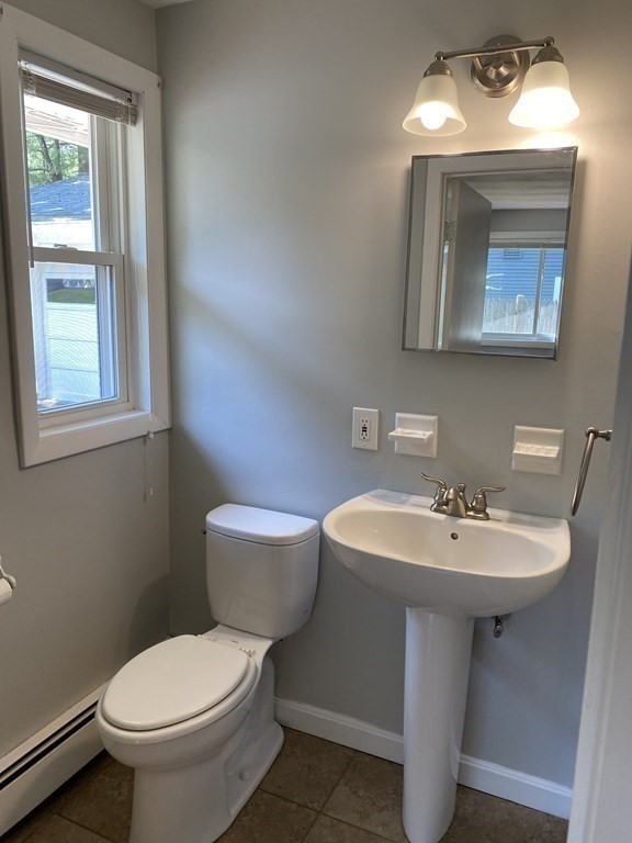28 Savoy Road Framingham, MA 01701 - Photo 25 of 42 a bathroom with a toilet sink and mirror