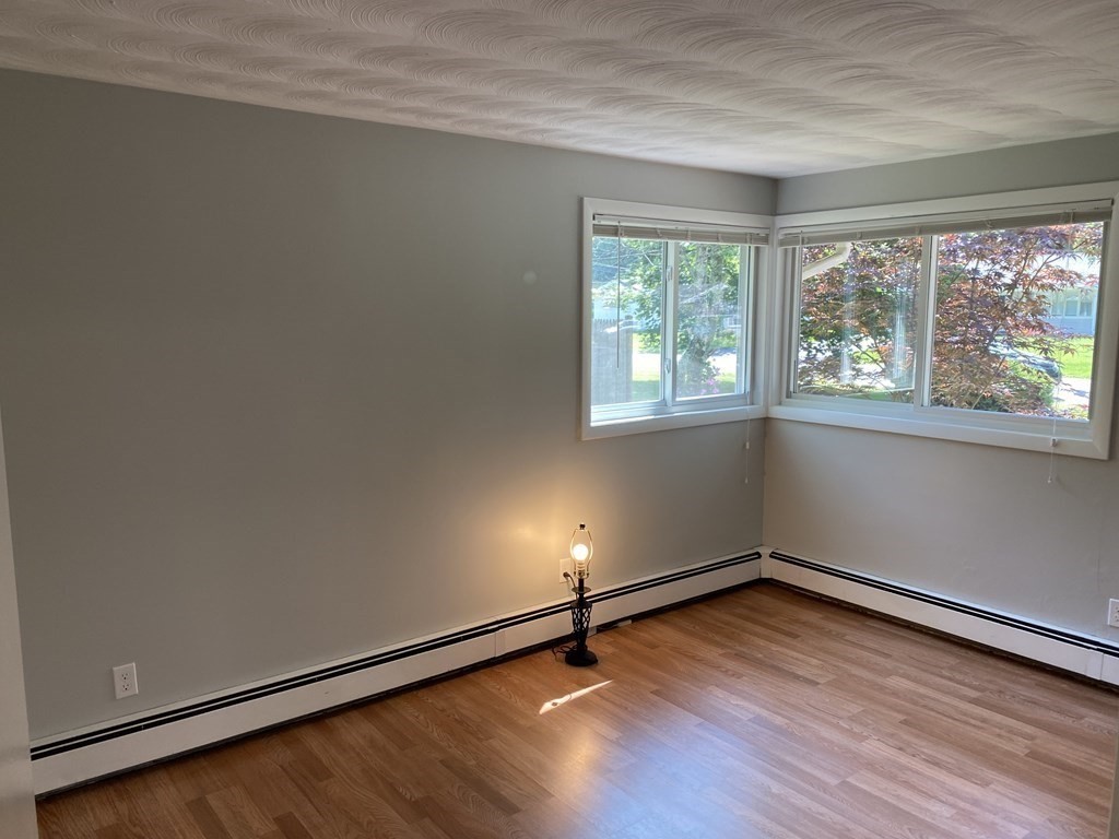 28 Savoy Road Framingham, MA 01701 - Photo 26 of 42 an empty room with wooden floor and windows