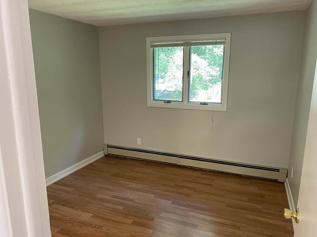 28 Savoy Road Framingham, MA 01701 - Photo 27 of 42 an empty room with wooden floor and windows