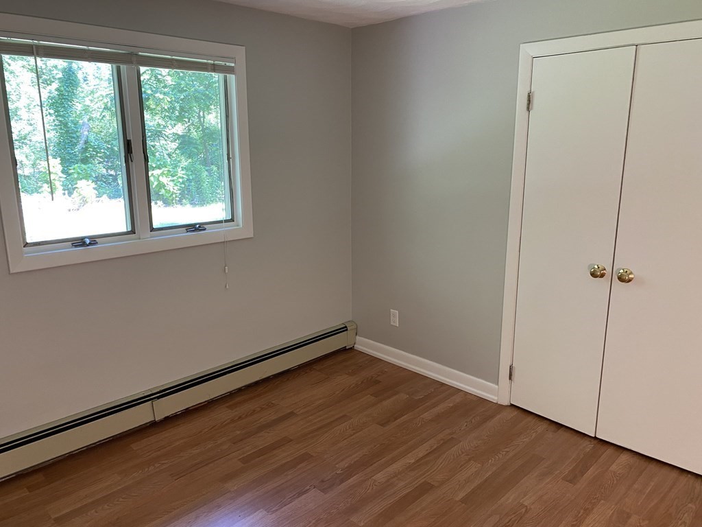 28 Savoy Road Framingham, MA 01701 - Photo 29 of 42 an empty room with wooden floor and windows