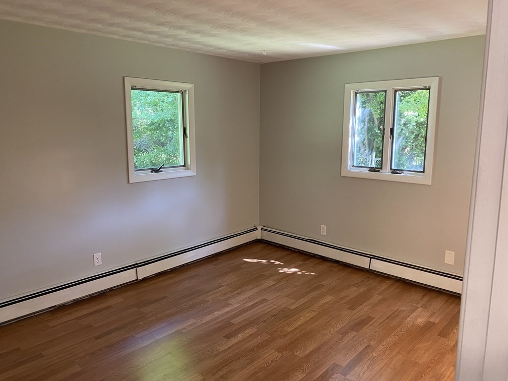 28 Savoy Road Framingham, MA 01701 - Photo 31 of 42 an empty room with wooden floor and windows