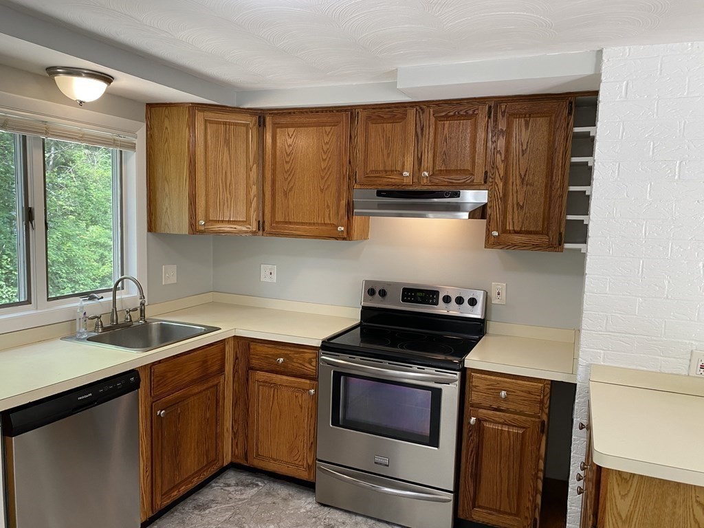 28 Savoy Road Framingham, MA 01701 - Photo 7 of 42 a kitchen with a sink stove top oven and cabinets