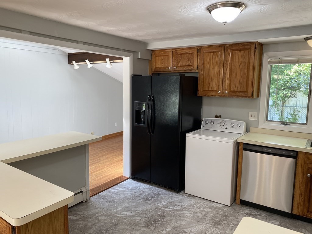 28 Savoy Road Framingham, MA 01701 - Photo 9 of 42 a utility room with dryer and washer