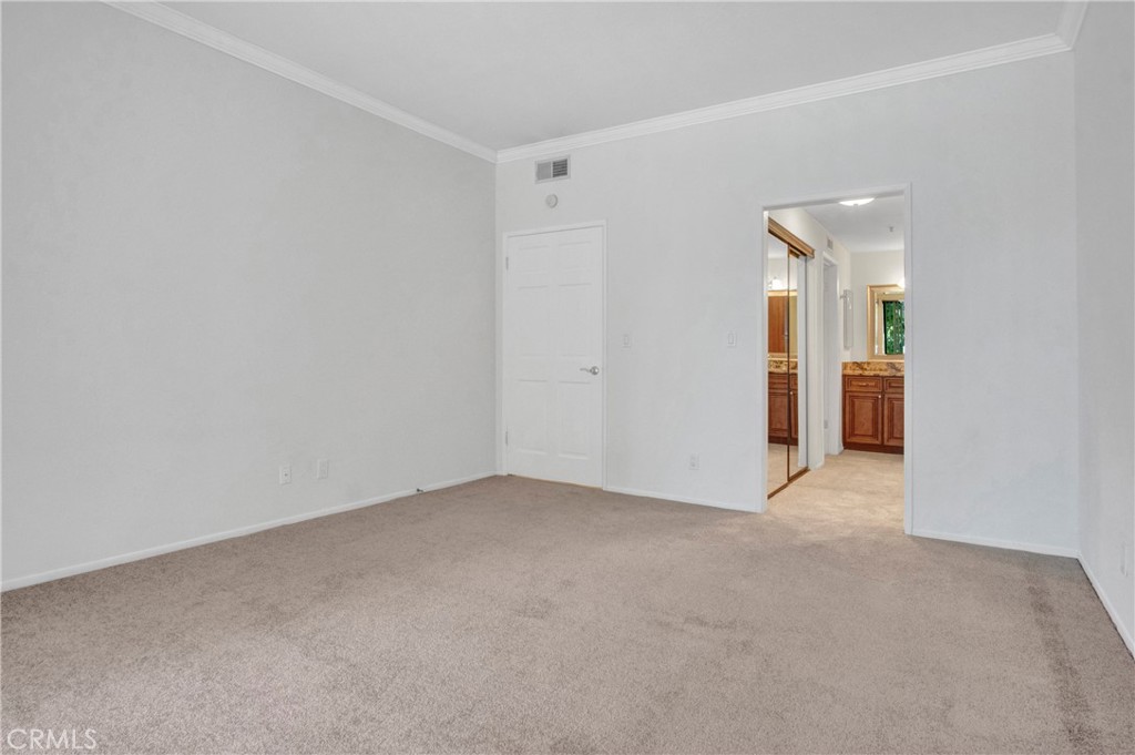 2571 Plaza Del Amo, Unit 107 Torrance, CA 90503 - Photo 17 of 33 a view of an empty room with closet and wooden floor