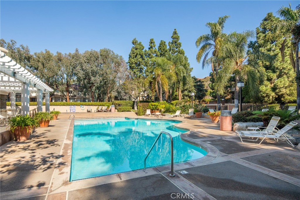 2571 Plaza Del Amo, Unit 107 Torrance, CA 90503 - Photo 26 of 33 a view of a swimming pool with an outdoor space and seating area