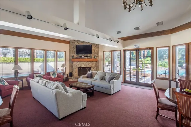 a view of a patio with table and chairs and potted plants