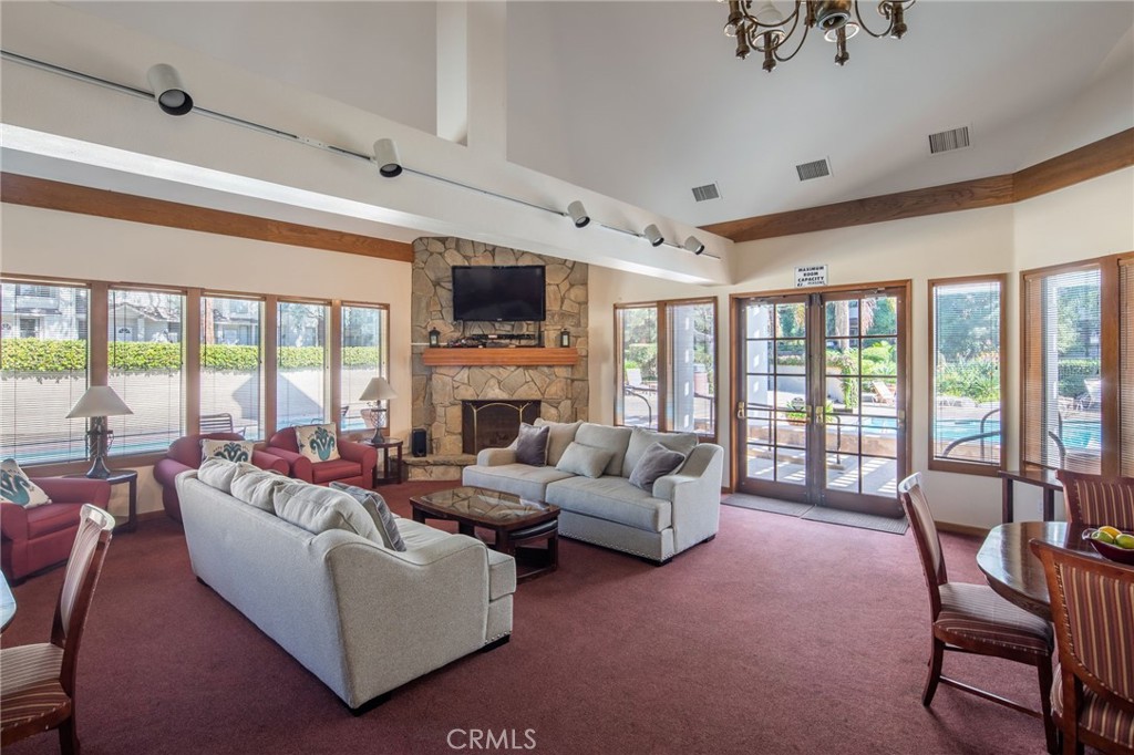 2571 Plaza Del Amo, Unit 107 Torrance, CA 90503 - Photo 29 of 33 a living room with fireplace furniture and a large window