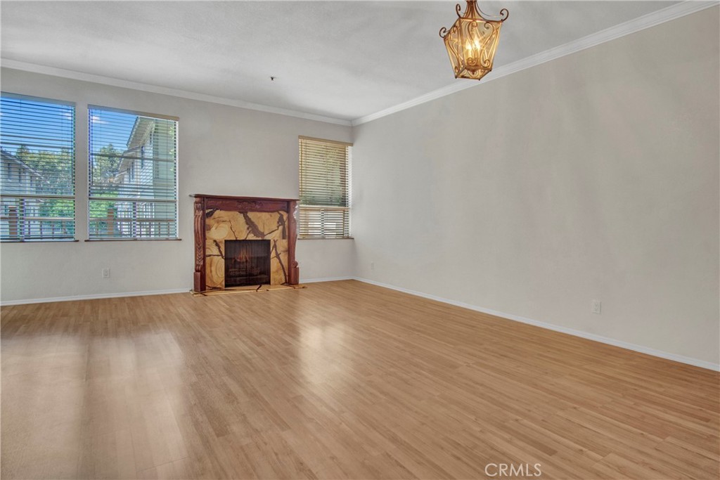 2571 Plaza Del Amo, Unit 107 Torrance, CA 90503 - Photo 4 of 33 a view of empty room with wooden floor and fan