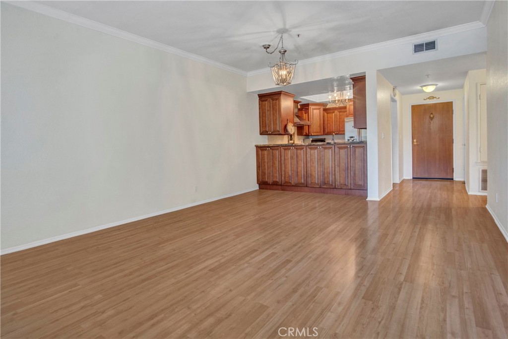 2571 Plaza Del Amo, Unit 107 Torrance, CA 90503 - Photo 7 of 33 a view of a room with wooden floor and large window