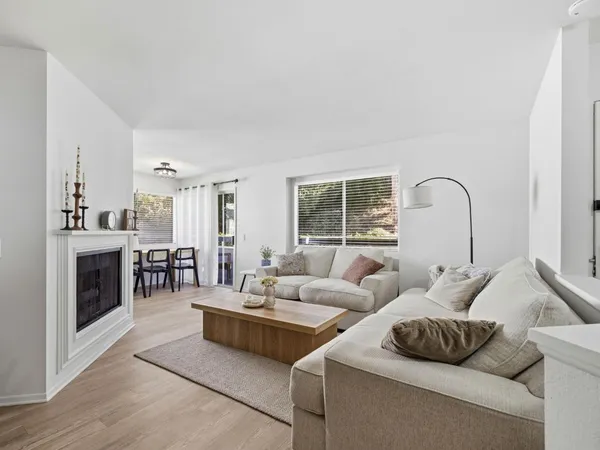 a living room with furniture and fireplace