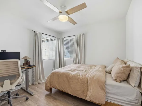 a bedroom with a bed and window