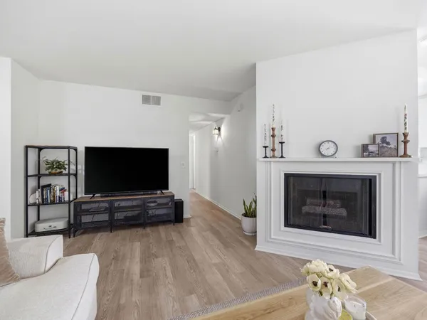 a kitchen with a sink cabinets stainless steel appliances and a window
