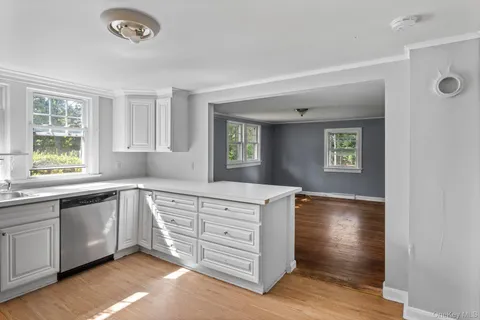 a kitchen with a sink and a window