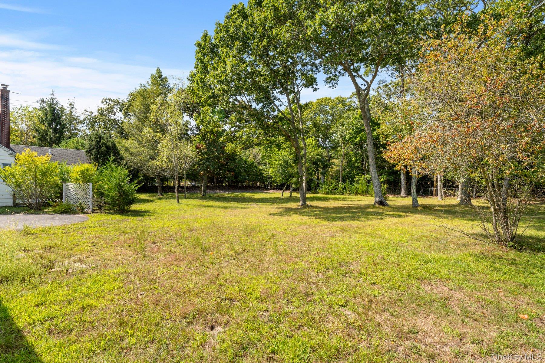 39-41 Foster Road Quogue, NY 11959 - Photo 13 of 13 a view of a swimming pool with an outdoor space and seating area
