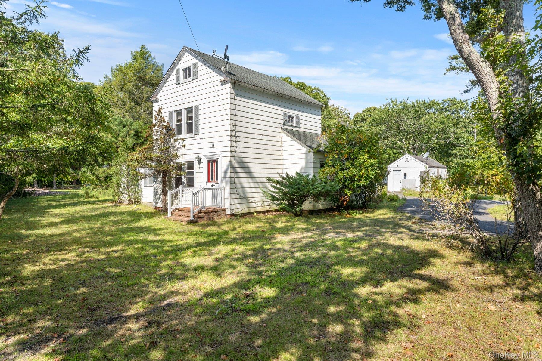 39-41 Foster Road Quogue, NY 11959 - Photo 4 of 13 a view of a house with a yard