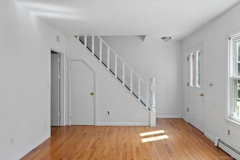 a view of entryway with wooden floor