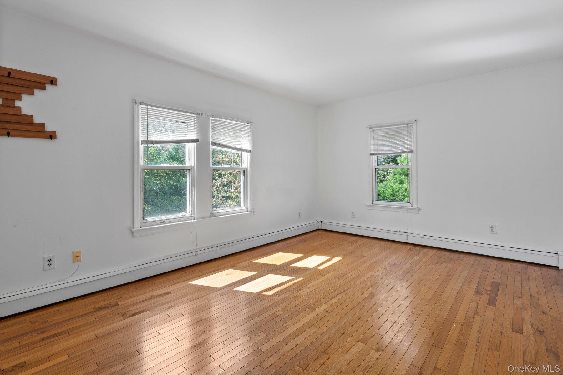 39-41 Foster Road Quogue, NY 11959 - Photo 8 of 13 an empty room with window