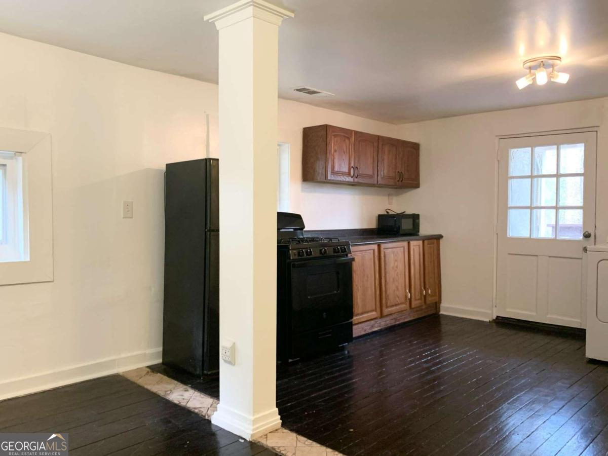 162 Ridgeland Avenue, Unit A Decatur, GA 30030 - Photo 1 of 1 a kitchen with stainless steel appliances a refrigerator and a stove