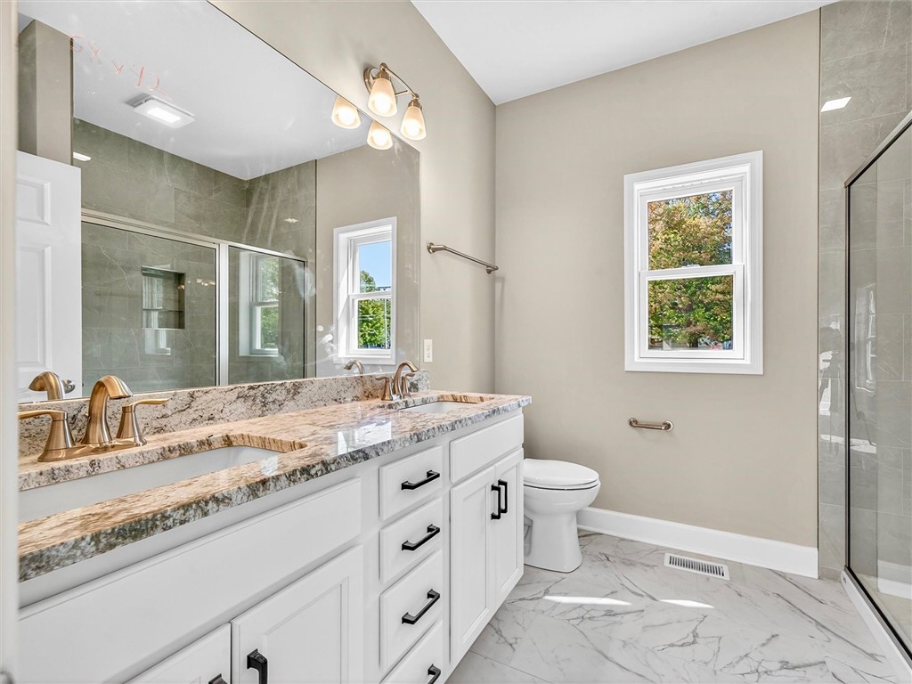 1119 Wall Road Webster, NY 14580 - Photo 25 of 49 Primary full bathroom with double sink quartz coun